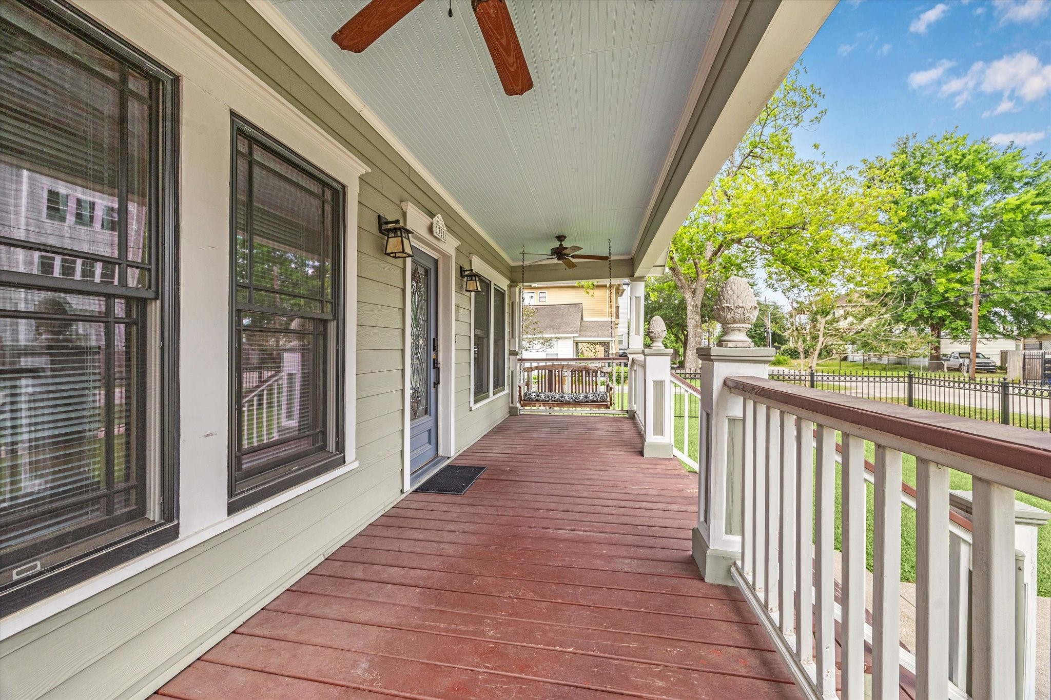 1321 West 21st Street Houston, TX 77008 - Photo 5 of 31 nviting covered front porch with ceiling fans for added comfort. Railings and decorative columns highlight the home’s character. Ideal space for outdoor seating or relaxation. Elevated porch provides a pleasant view of the front yard.