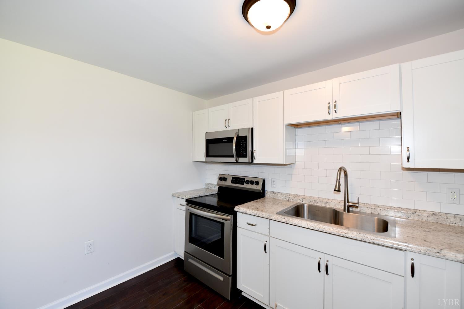 5763 3 Creeks Road Gladys, VA 24554 - Photo 12 of 25 a kitchen with a sink cabinets and appliances