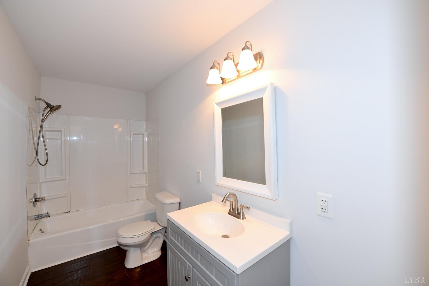 5763 3 Creeks Road Gladys, VA 24554 - Photo 20 of 25 a bathroom with a sink toilet and shower