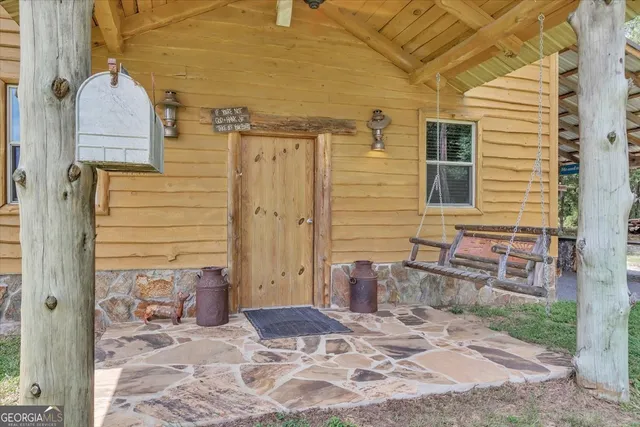 a living room with pool table and a flat screen tv