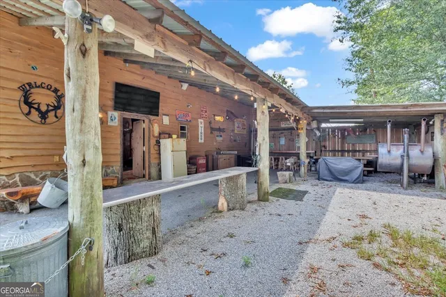 a view of a house with a yard and deck