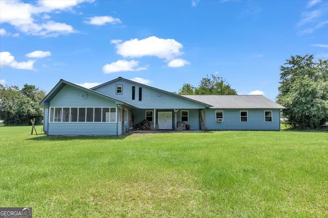 a bathroom with a sink a mirror and a shower