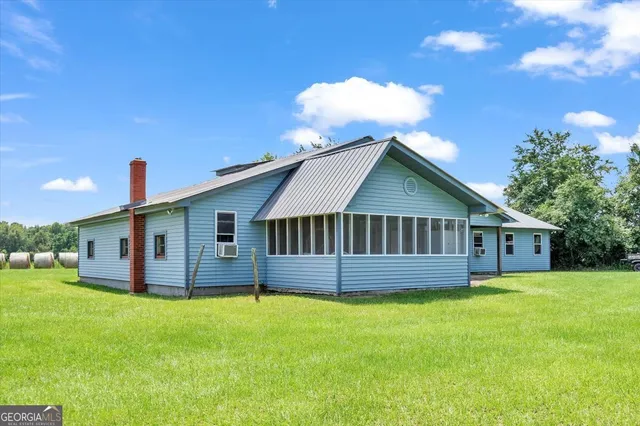 a living room with furniture ceiling fan and a rug