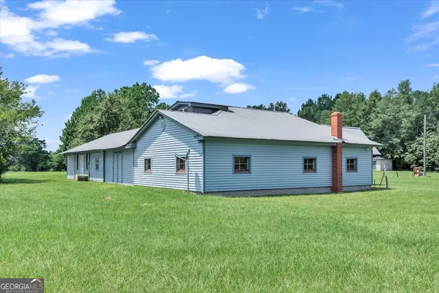 a very nice looking dining room with a large window