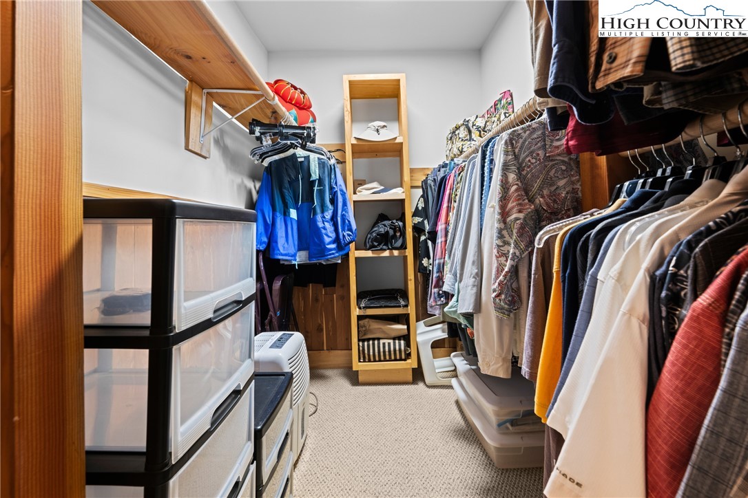 349 Belmont Drive Boone, NC 28607 - Photo 13 of 49 a view of walk in closet with clothes and shoes