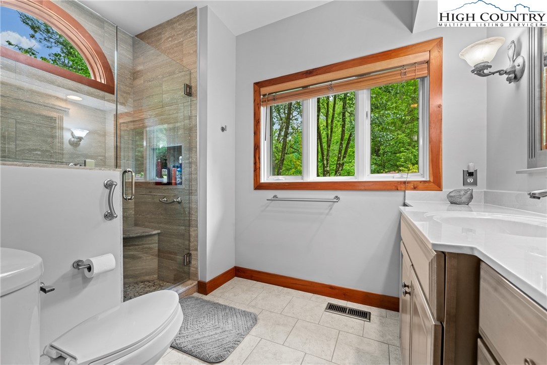 349 Belmont Drive Boone, NC 28607 - Photo 16 of 49 a bathroom with a sink toilet and shower