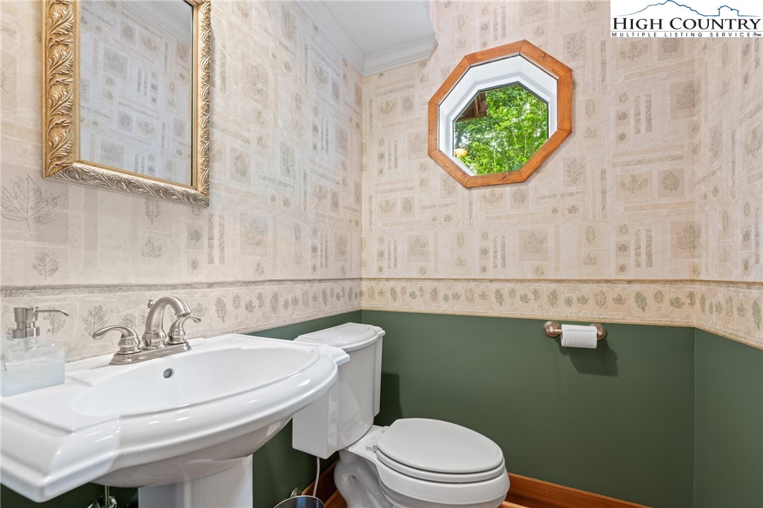 349 Belmont Drive Boone, NC 28607 - Photo 17 of 49 a bathroom with a sink a toilet and a mirror