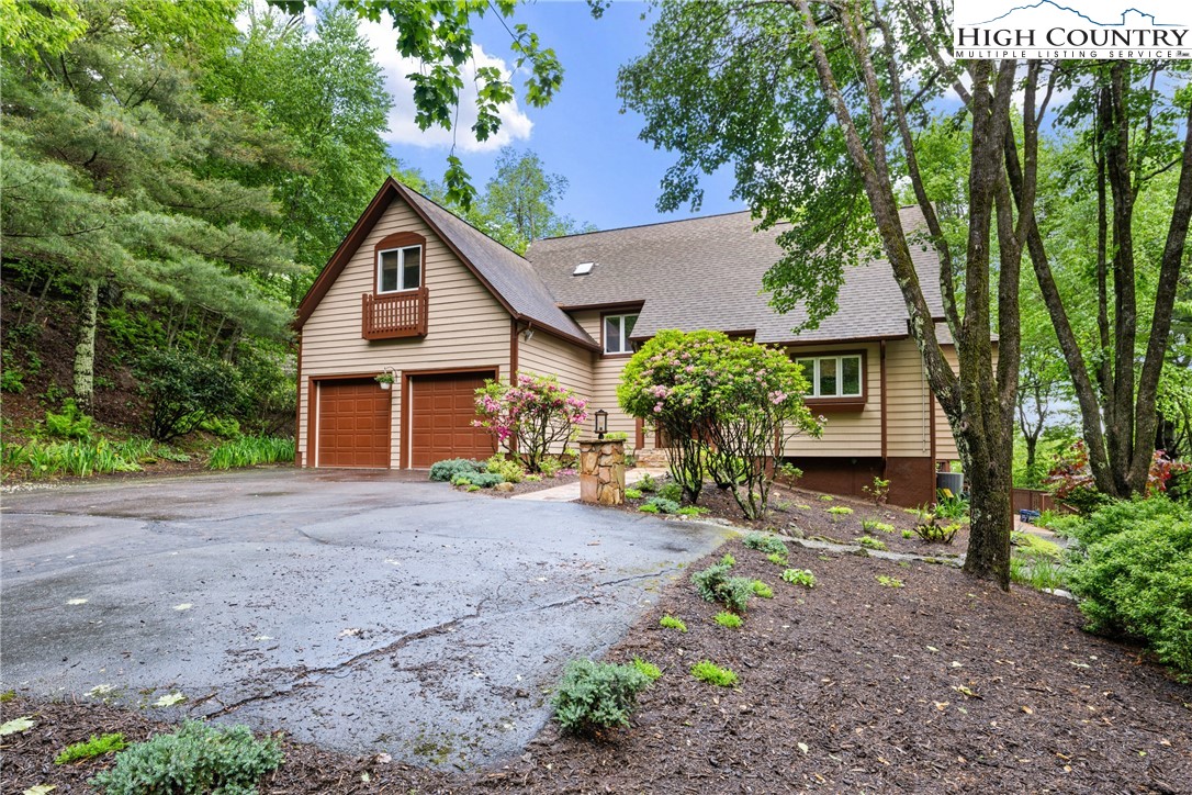 349 Belmont Drive Boone, NC 28607 - Photo 2 of 49 a front view of a house with garden