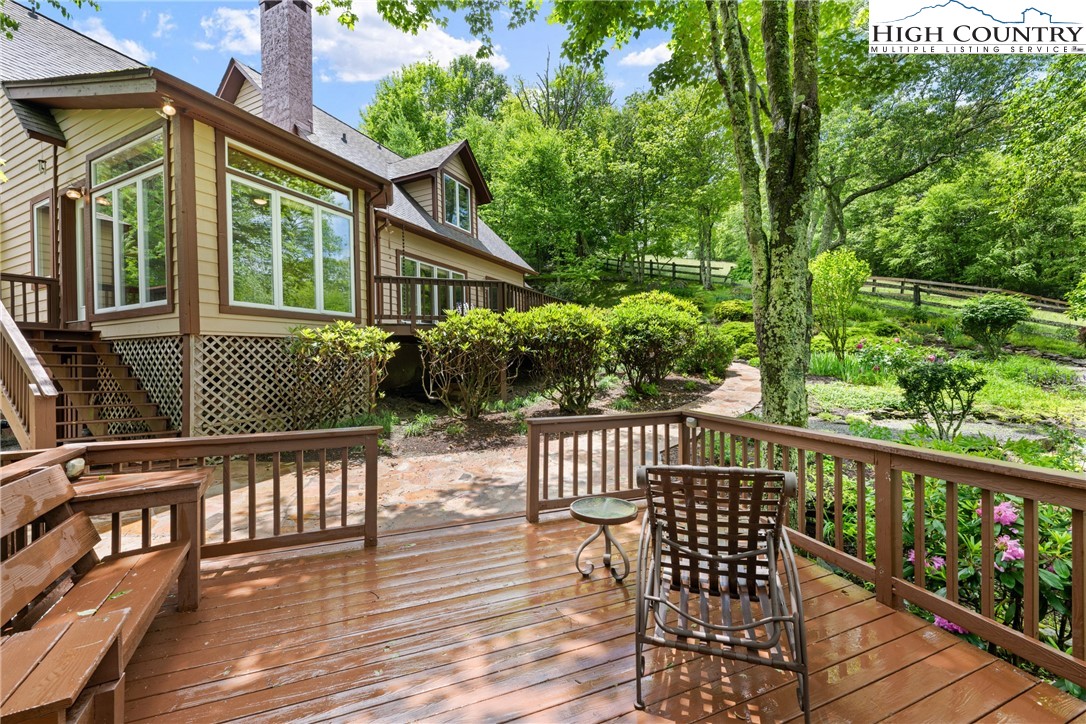 349 Belmont Drive Boone, NC 28607 - Photo 26 of 49 a view of a wooden deck with chairs