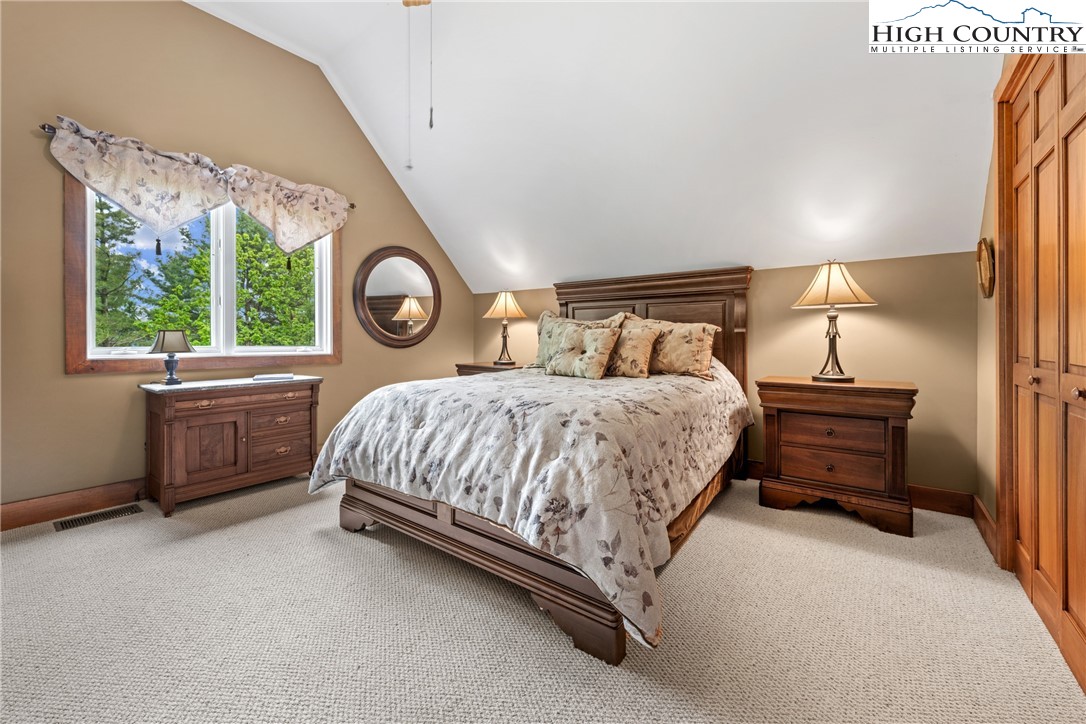 349 Belmont Drive Boone, NC 28607 - Photo 30 of 49 a bed room with a bed and a closet