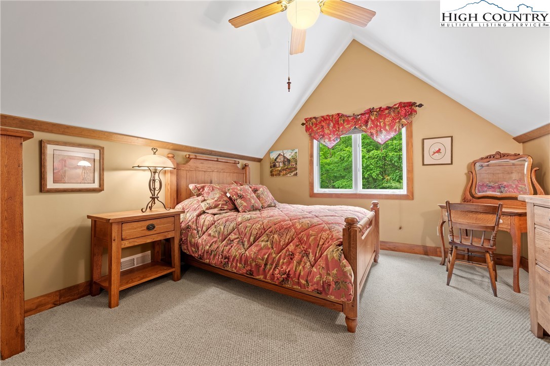 349 Belmont Drive Boone, NC 28607 - Photo 36 of 49 a bed room with a bed and a chair