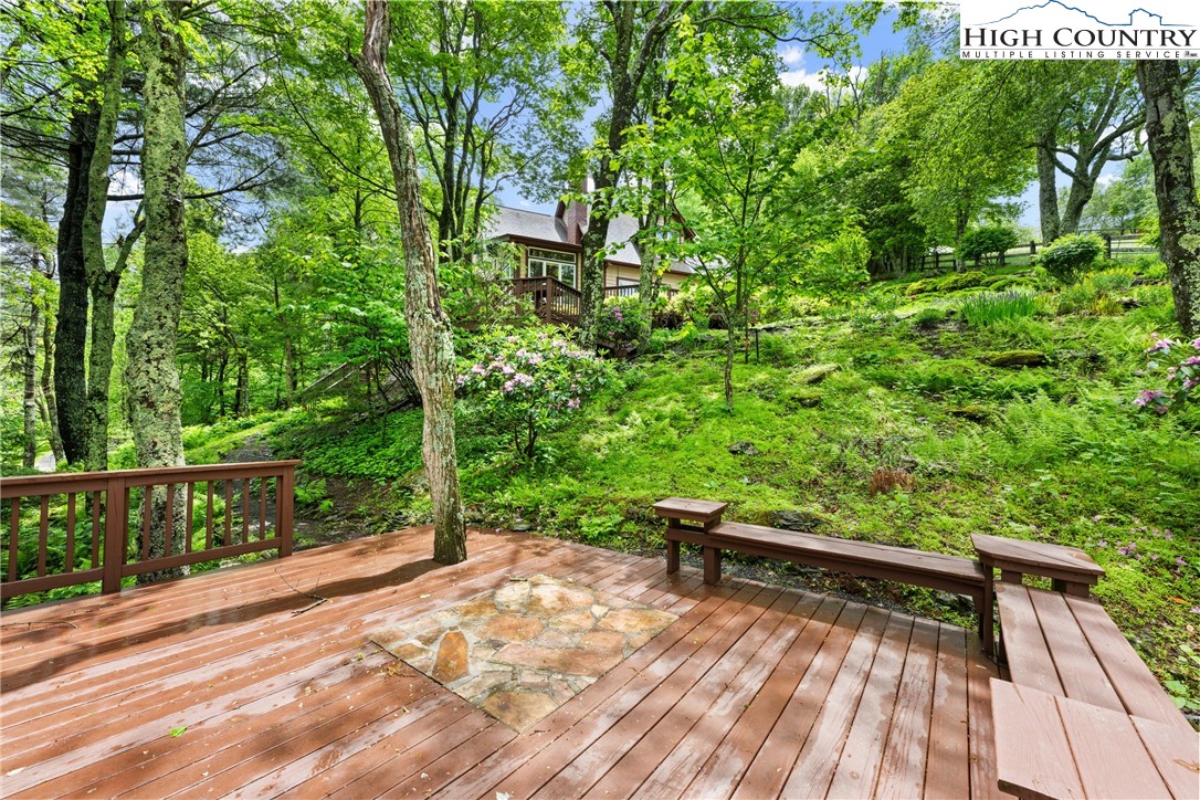 349 Belmont Drive Boone, NC 28607 - Photo 38 of 49 a view of backyard with deck and garden