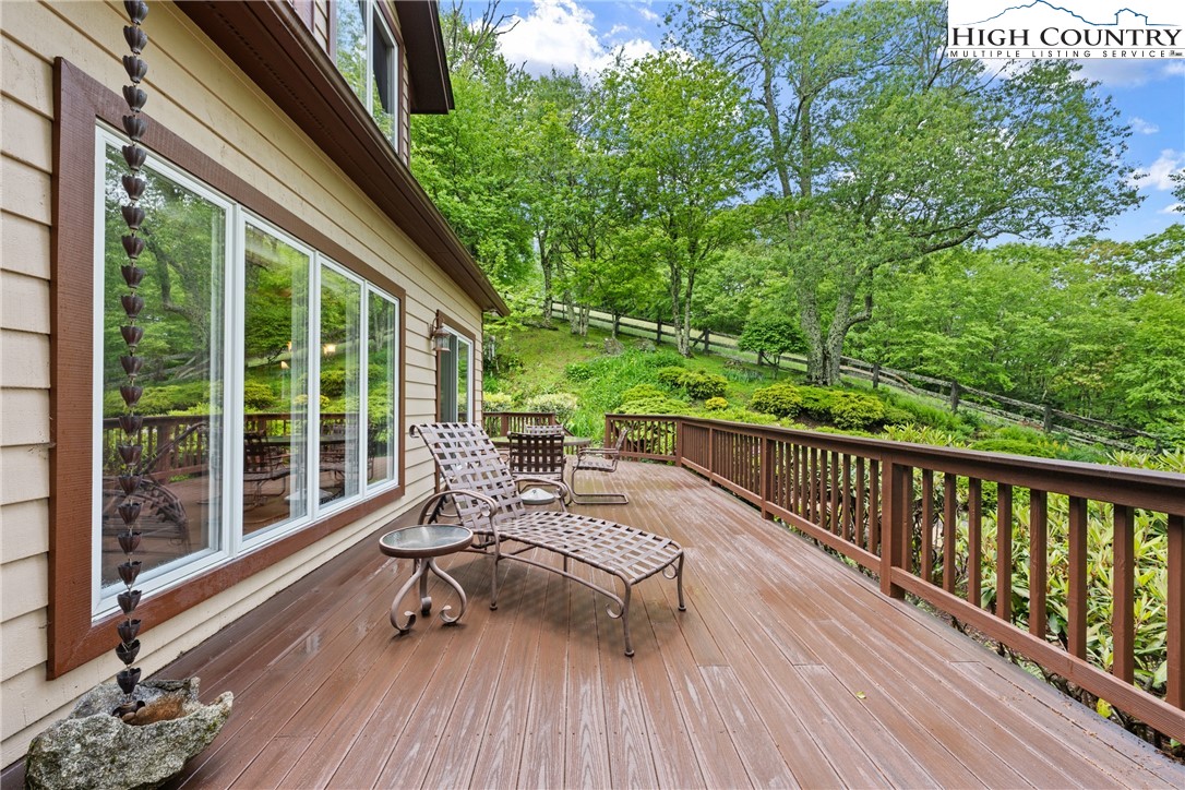 349 Belmont Drive Boone, NC 28607 - Photo 39 of 49 a balcony with wooden floor and outdoor seating