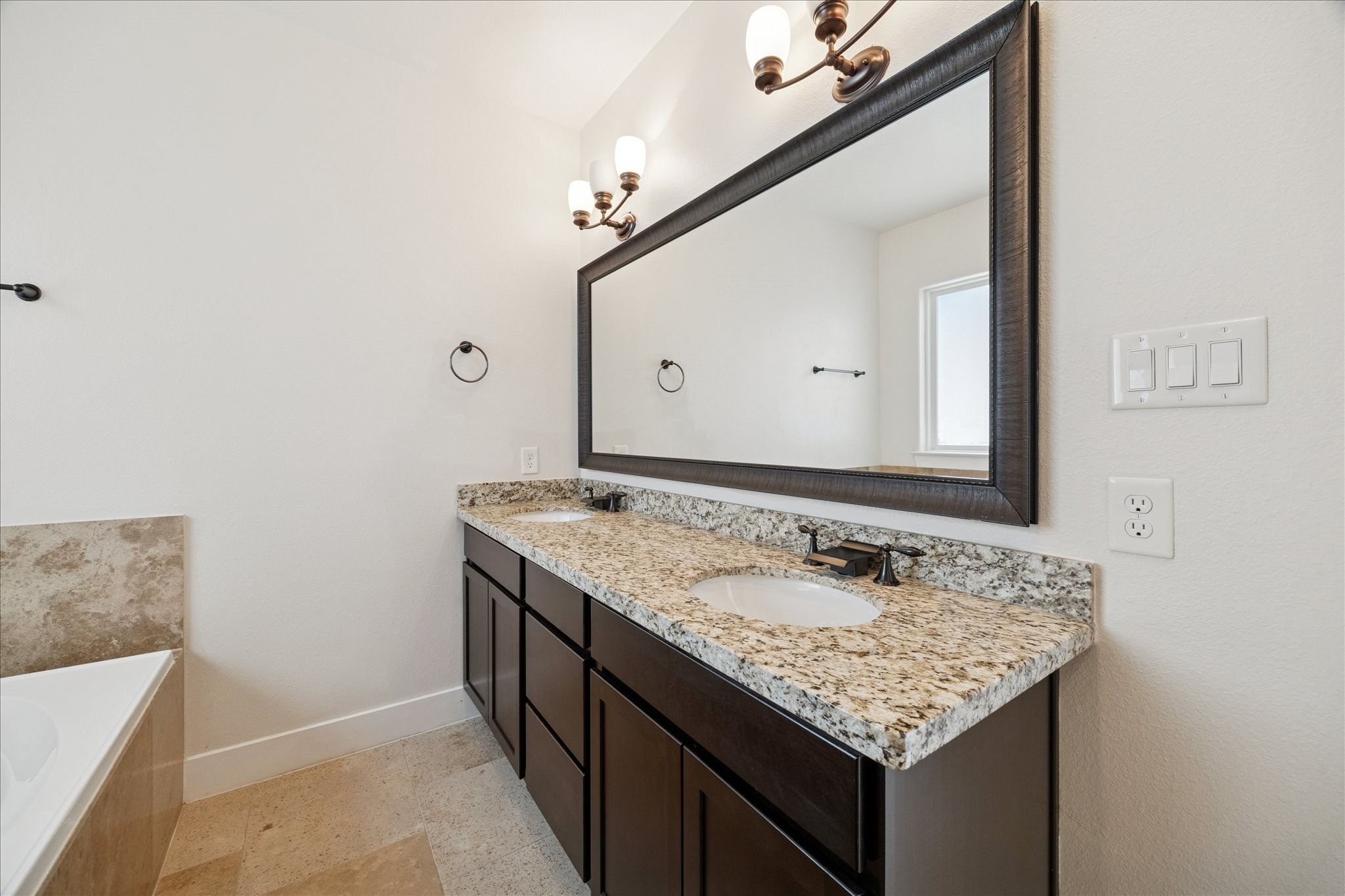 1546 West 23rd Street Houston, TX 77008 - Photo 13 of 20 a bathroom with a granite countertop sink and a mirror