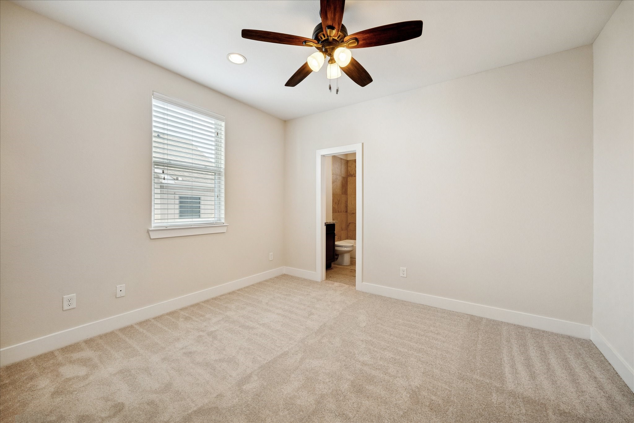 1546 West 23rd Street Houston, TX 77008 - Photo 16 of 20 an empty room with windows and fan