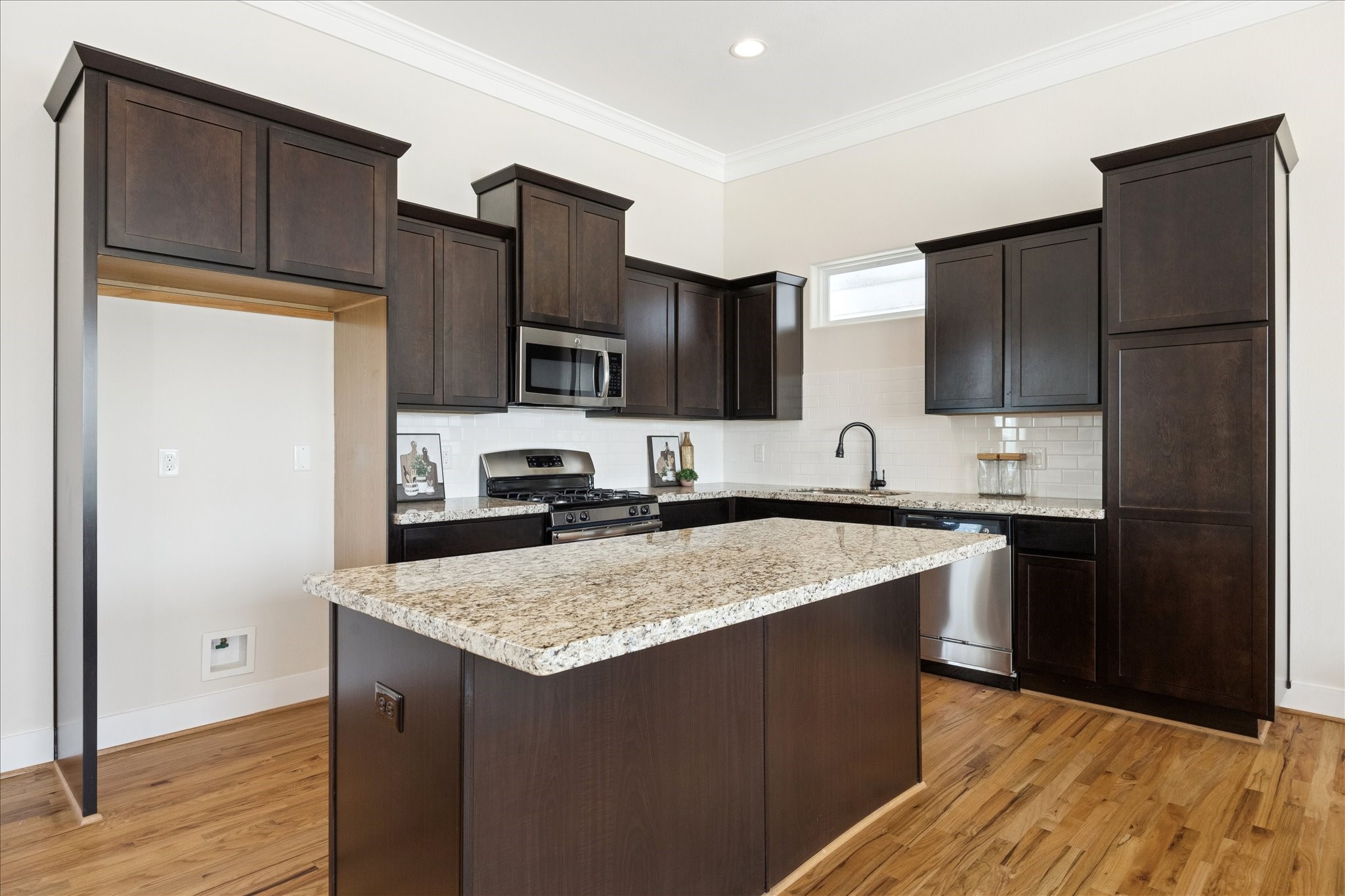 1546 West 23rd Street Houston, TX 77008 - Photo 7 of 20 a kitchen with a refrigerator stove top oven and sink