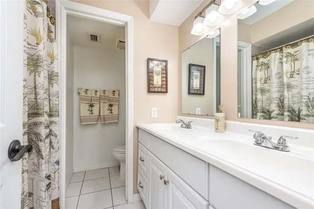 a bedroom with a bed and a tv