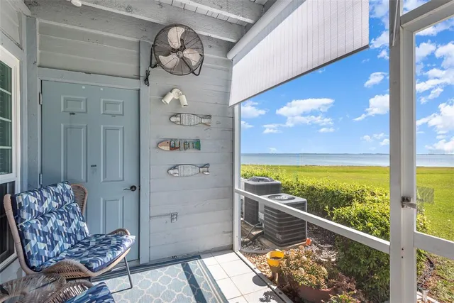 a view of swimming pool with outdoor seating and city view