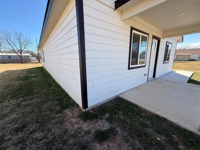 a view of front door and yard