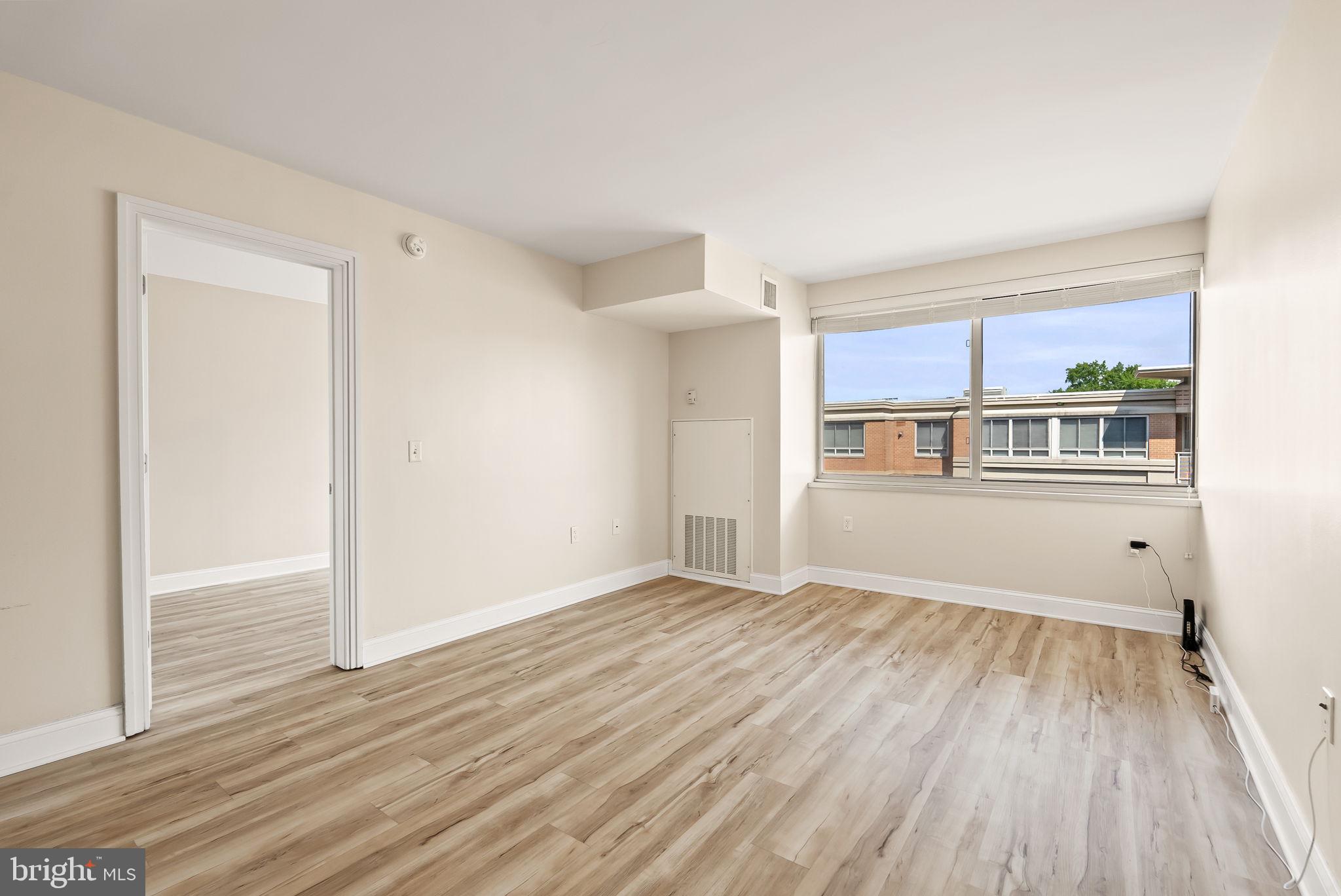 800 4th Street Southwest, Unit S513 Washington, DC 20024 - Photo 11 of 28 wooden floor in an empty room