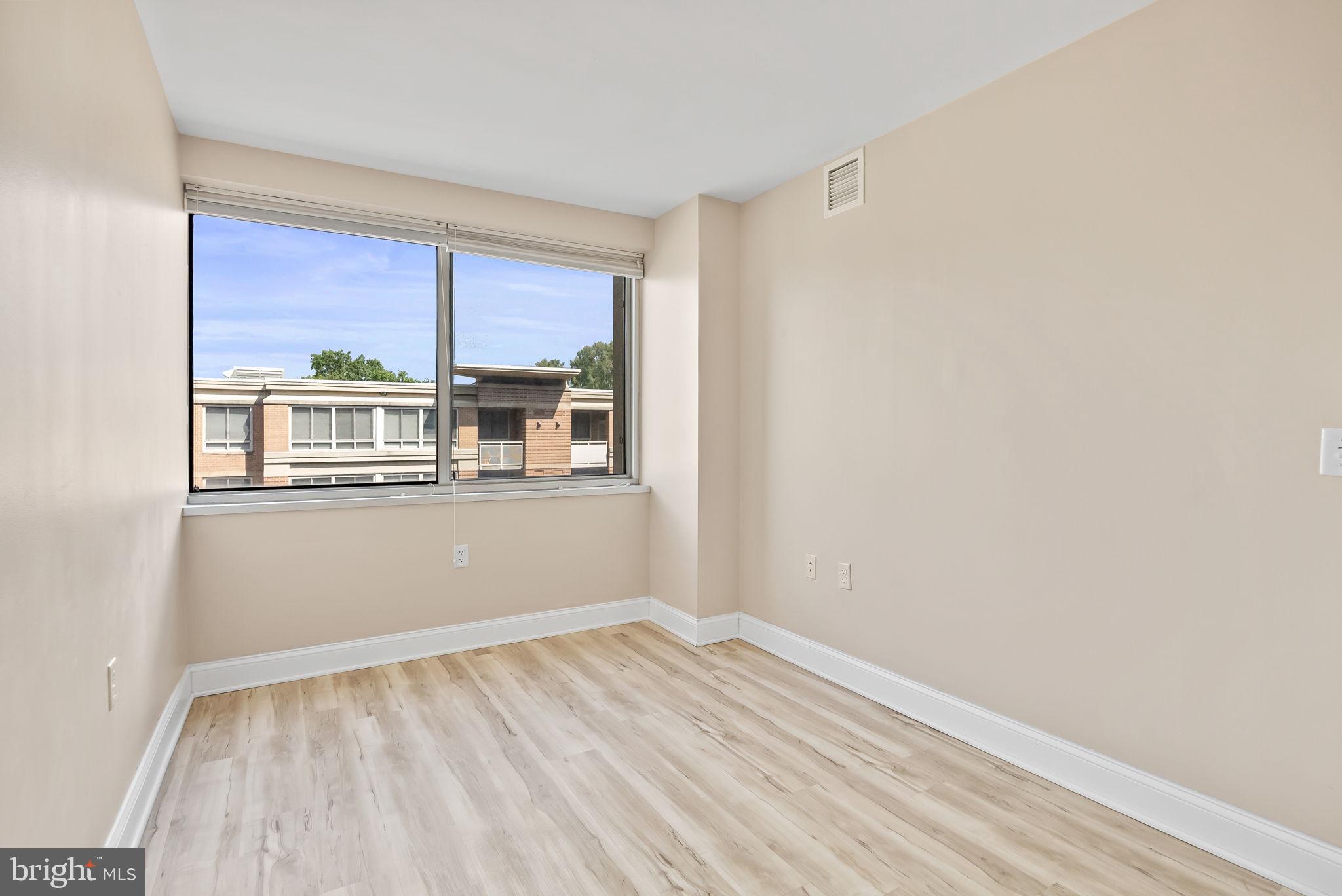 800 4th Street Southwest, Unit S513 Washington, DC 20024 - Photo 14 of 28 a view of empty room with wooden floor and fan