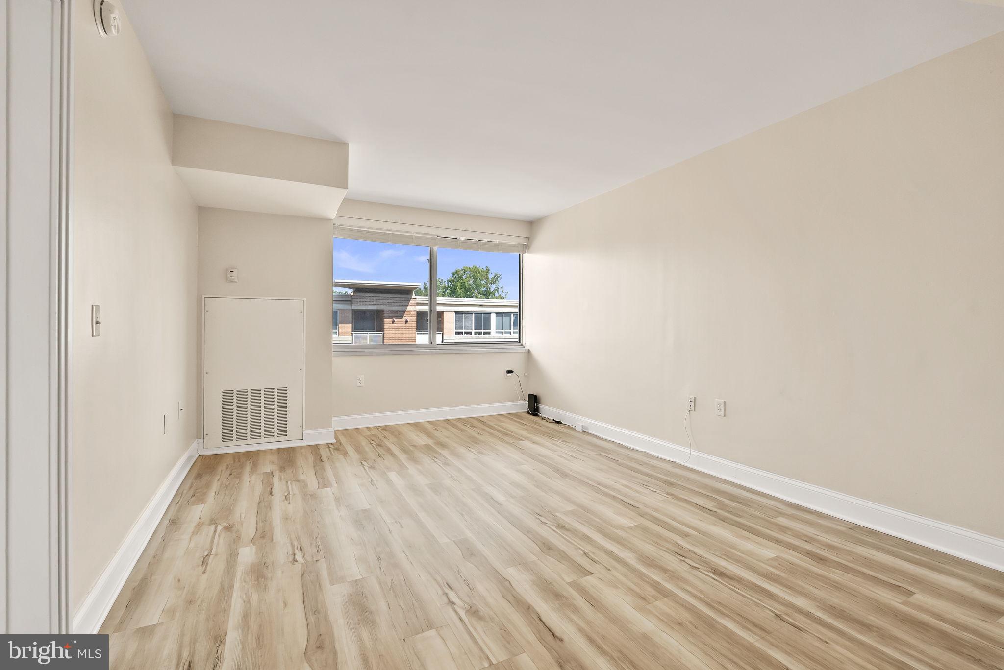 800 4th Street Southwest, Unit S513 Washington, DC 20024 - Photo 10 of 28 a view of a room with wooden floor and a window