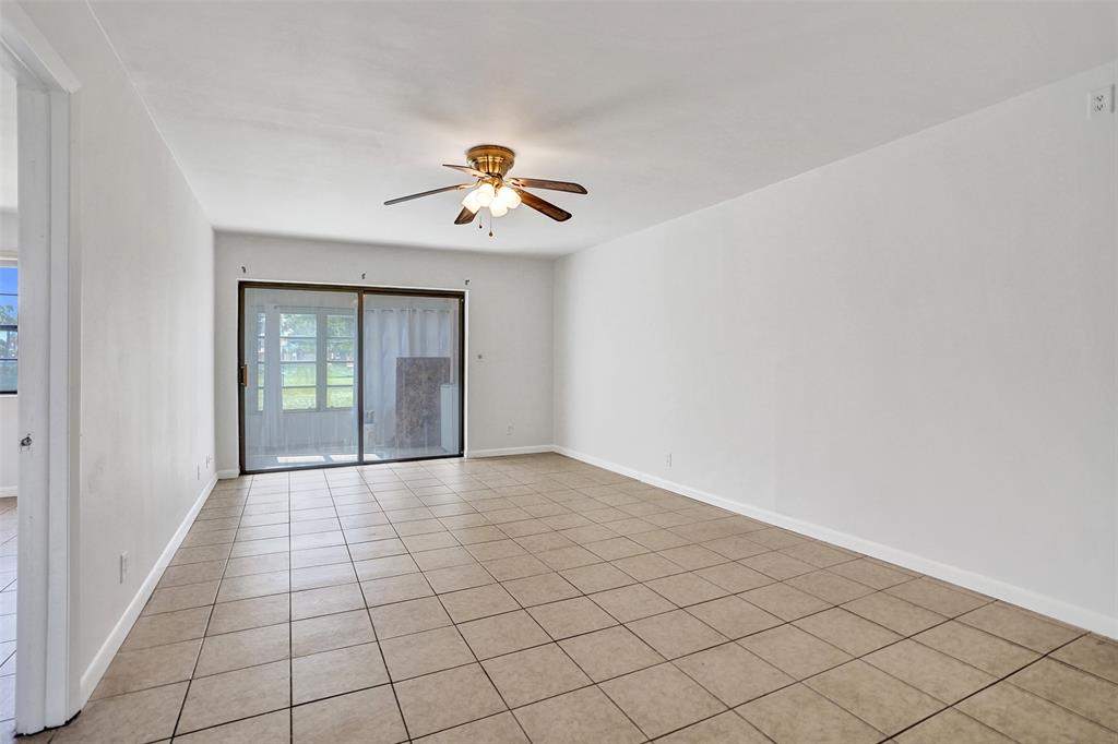 9273 Southwest 8th Street, Unit 117 Boca Raton, FL 33428 - Photo 11 of 40 a view of an empty room with a window