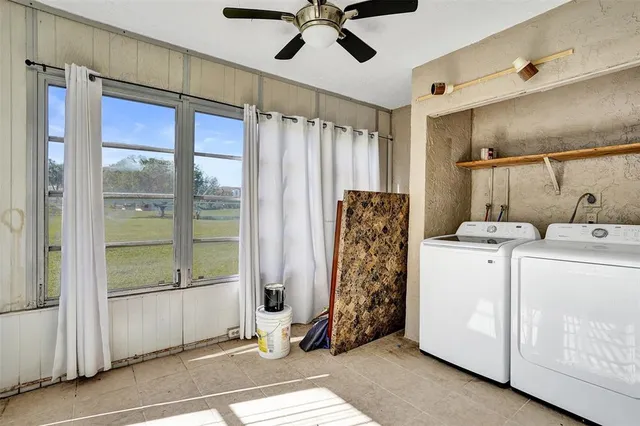 a view of a hallway with washer and dryer