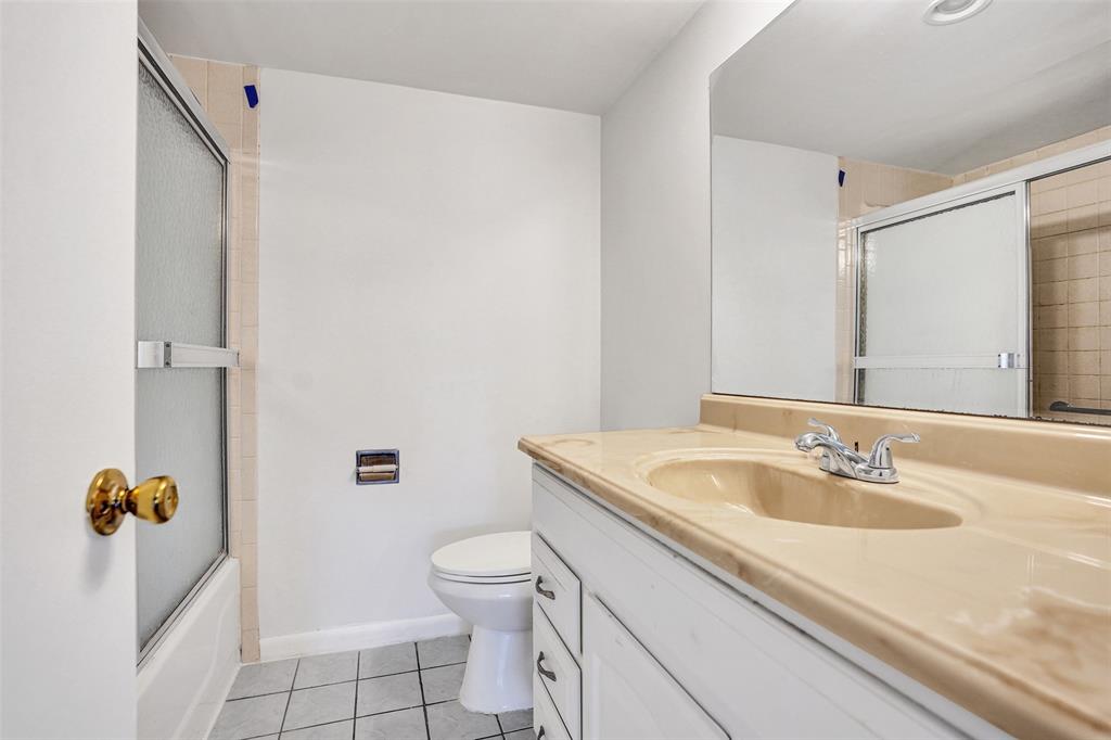 9273 Southwest 8th Street, Unit 117 Boca Raton, FL 33428 - Photo 20 of 40 a bathroom with a sink toilet and shower
