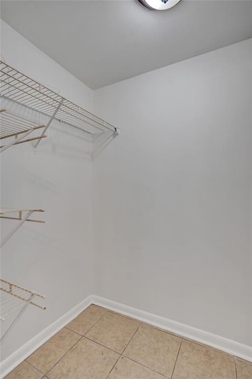 9273 Southwest 8th Street, Unit 117 Boca Raton, FL 33428 - Photo 24 of 40 a view of a room with racks on the wall