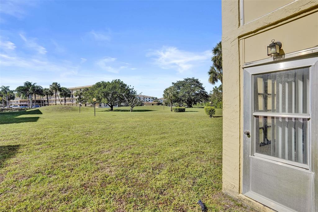 9273 Southwest 8th Street, Unit 117 Boca Raton, FL 33428 - Photo 25 of 40 a view of a balcony with ocean view