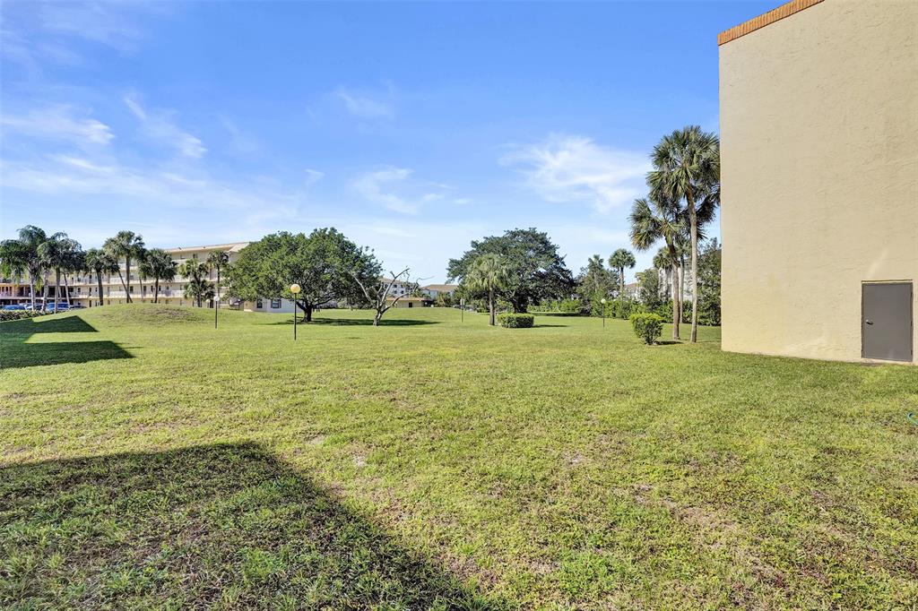 9273 Southwest 8th Street, Unit 117 Boca Raton, FL 33428 - Photo 26 of 40 a view of a field with an ocean