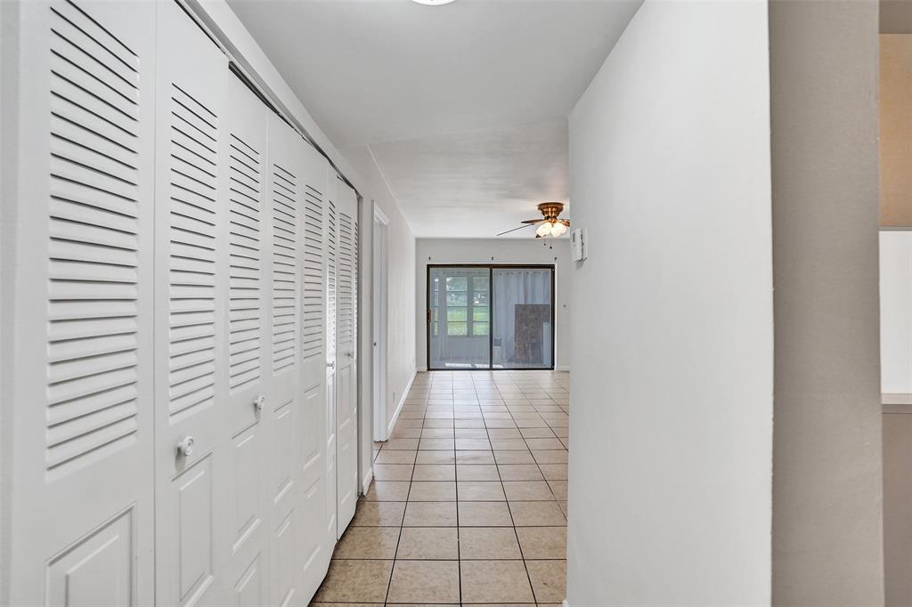 9273 Southwest 8th Street, Unit 117 Boca Raton, FL 33428 - Photo 3 of 40 a view of a hallway