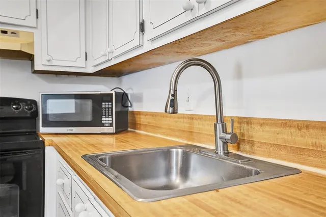 a view of a kitchen counter top of a stove