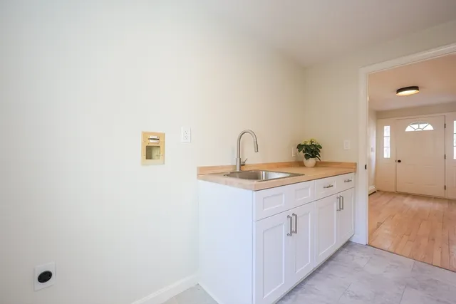 a bathroom with a double vanity sink and mirror
