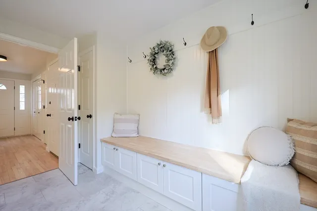 a spacious bathroom with a granite countertop sink a toilet and a shower