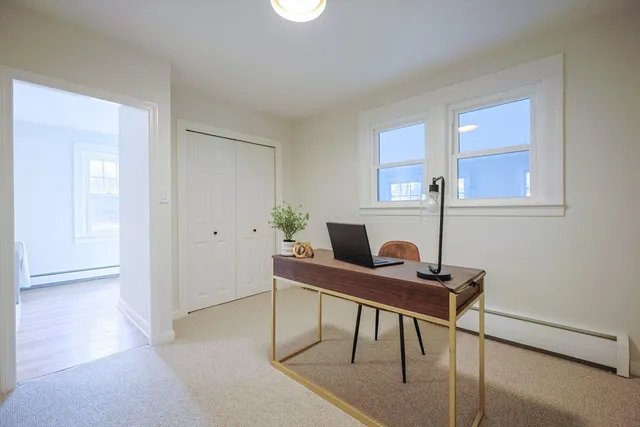 a workspace with furniture and window