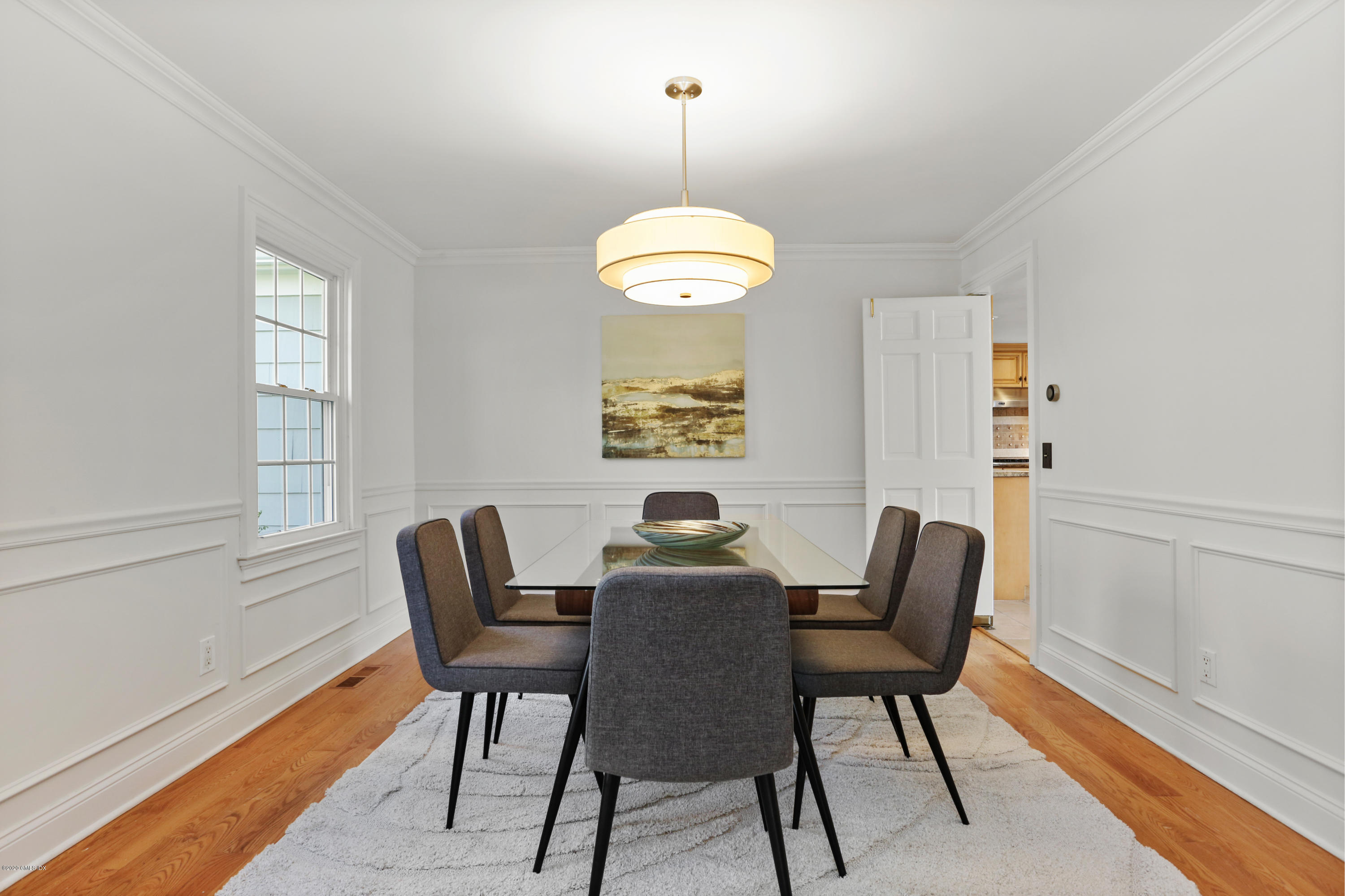 159 East Rocks Road, Unit 159 Norwalk, CT 06851 - Photo 6 of 32 a view of a dining room with furniture window and wooden floor