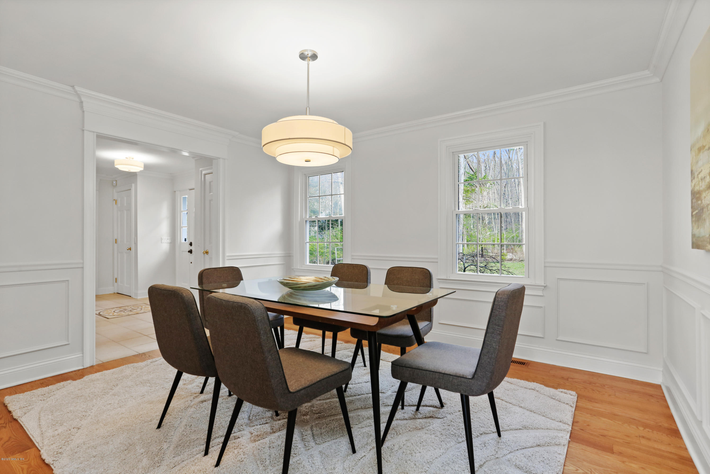159 East Rocks Road, Unit 159 Norwalk, CT 06851 - Photo 7 of 32 a view of a dining room with furniture window and wooden floor