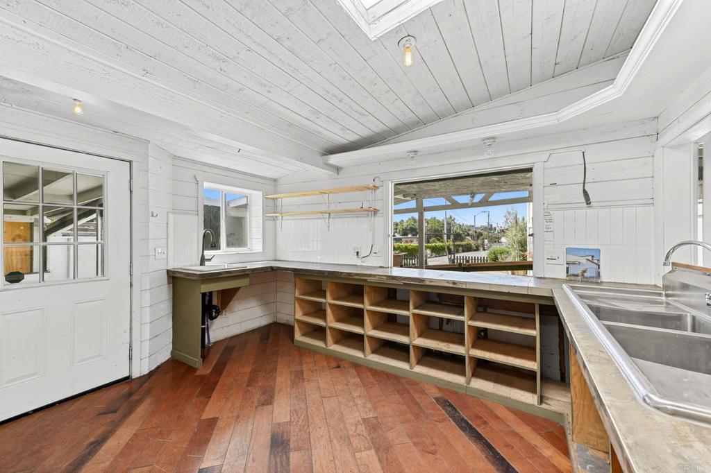 838 East Mission Road Fallbrook, CA 92028 - Photo 13 of 48 a view of an empty room with wooden floor and a window