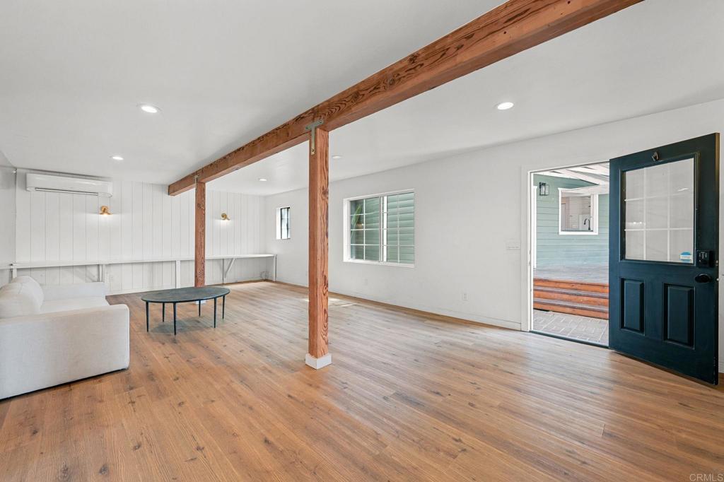 838 East Mission Road Fallbrook, CA 92028 - Photo 18 of 48 a view of livingroom with furniture wooden floor and windows