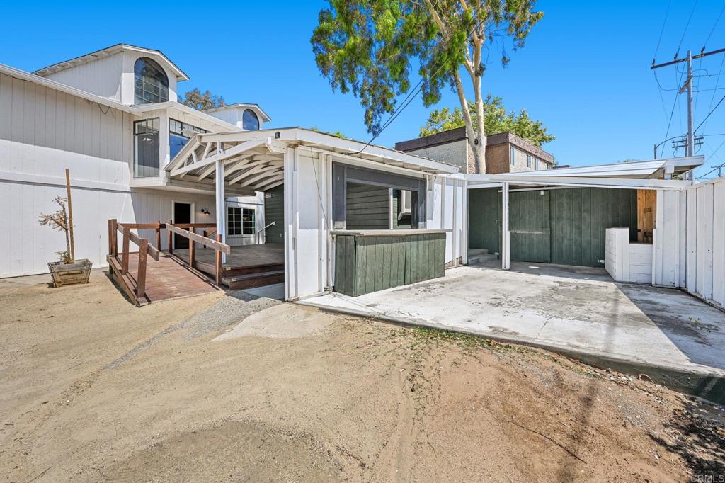 838 East Mission Road Fallbrook, CA 92028 - Photo 22 of 48 a view of a house with a yard and potted plants