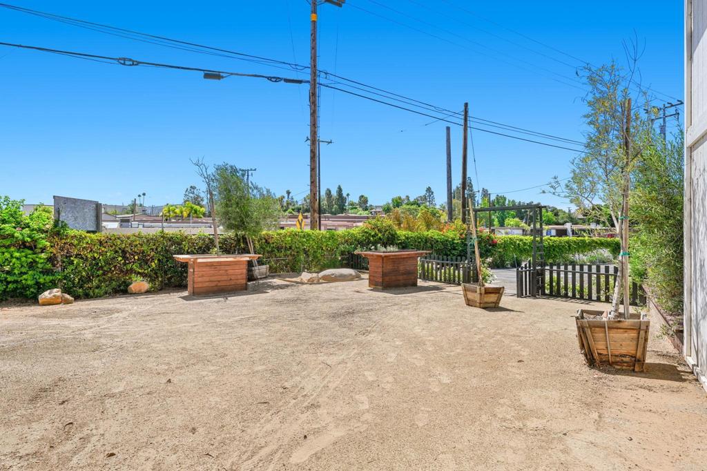 838 East Mission Road Fallbrook, CA 92028 - Photo 23 of 48 a view of a patio with a table chairs and a potted plants
