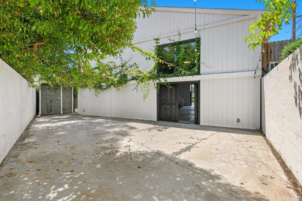 838 East Mission Road Fallbrook, CA 92028 - Photo 25 of 48 a front view of a house with a yard and garage