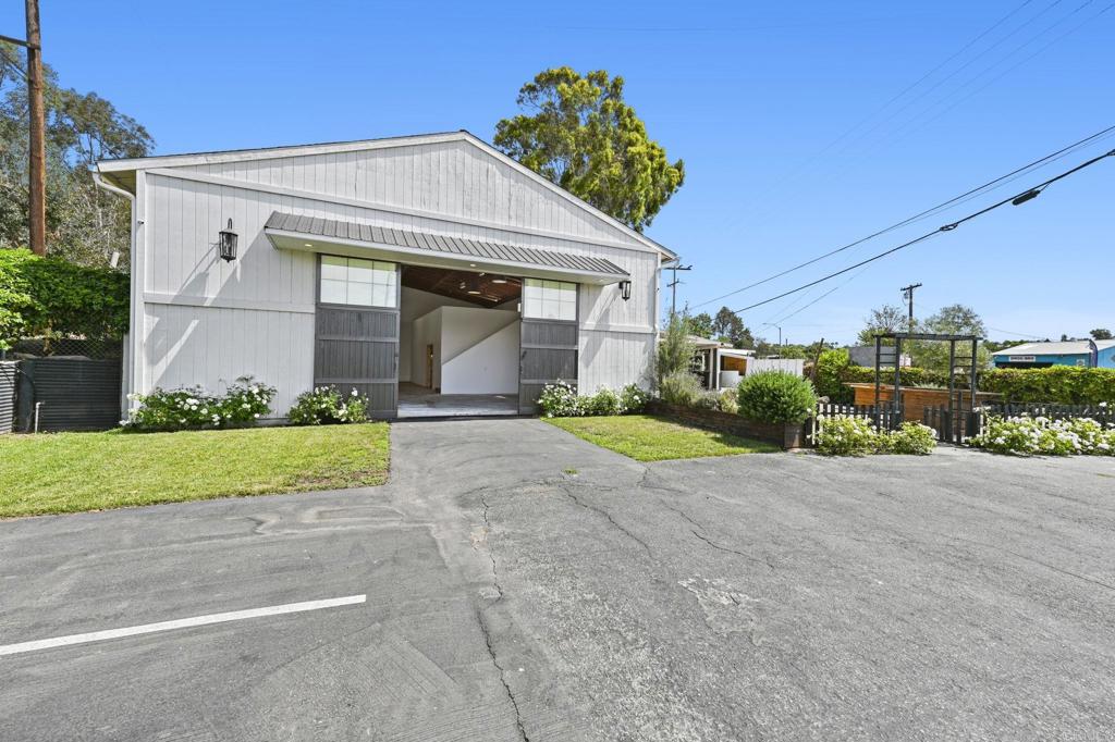 838 East Mission Road Fallbrook, CA 92028 - Photo 32 of 48 a front view of a house with a yard and garage