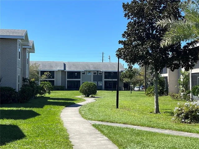 a view of a swimming pool with chairs