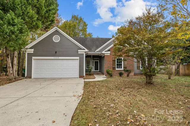 front view of a house with a yard