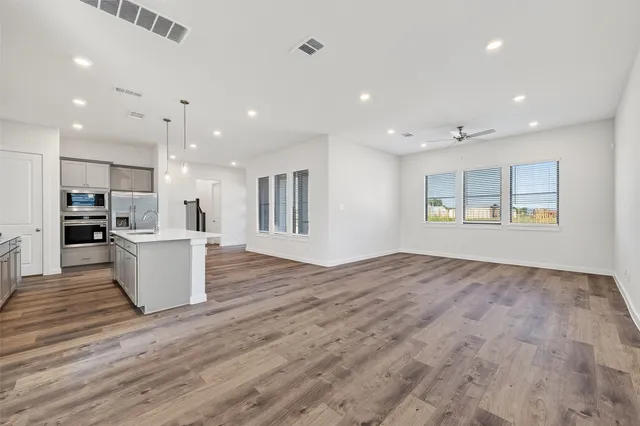 a view of kitchen and kitchen with windows