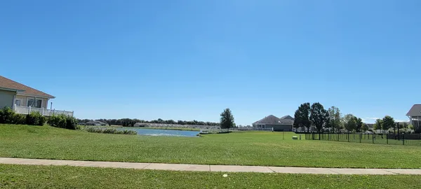 a view of a golf course with a field