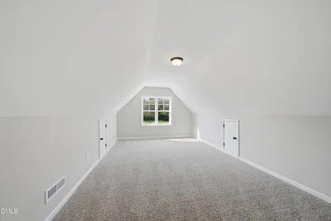 a view of empty room with windows